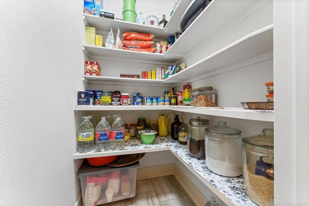 The walk-in pantry provides ample space for keeping items organized and accessible.