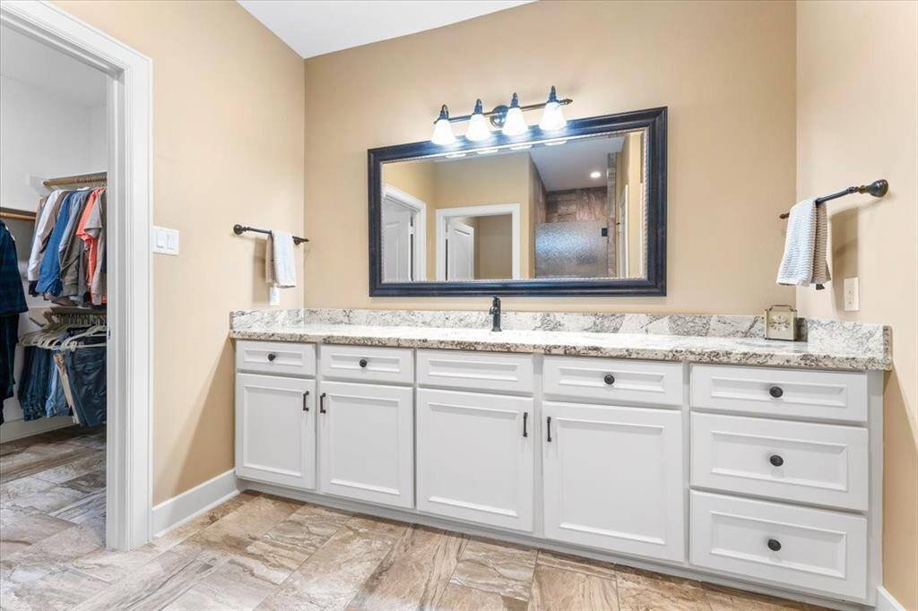 The primary bathroom room offers plenty of counter space for added convenience and organization.
