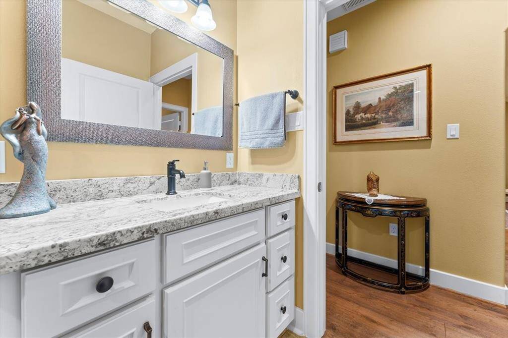 Secondary bathroom looking into the hallway where the guest rooms are located.