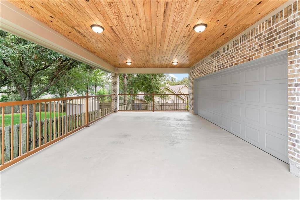 The attached carport is well lit and immaculate.