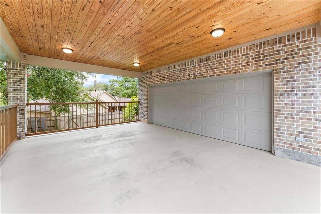 The carport ceiling features a stained ceiling, which adds so much character & leads into the garage which includes an automatic opener. This area is fantastic for entertaining guest!!!