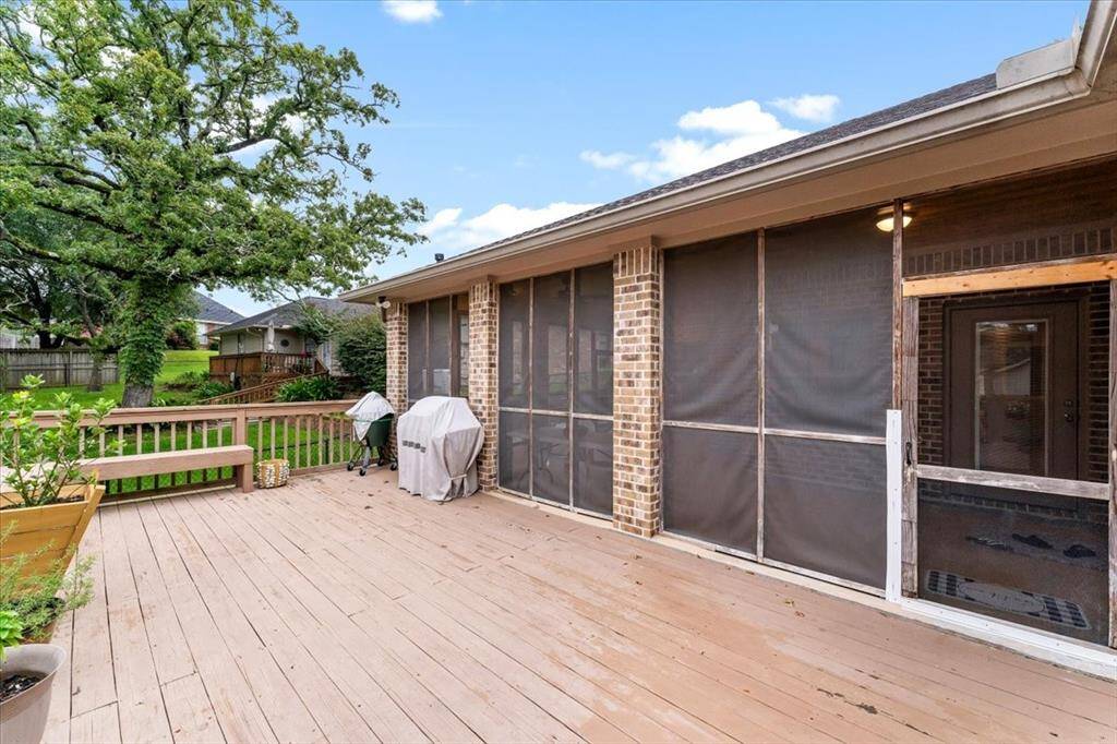 The back deck is always a nice way to join the outdoors of this property, which is located right off the screened in porch and has stairs to the backyard that will take you to a storage building that will be all yours with the purchase of this property. MUST SEE!