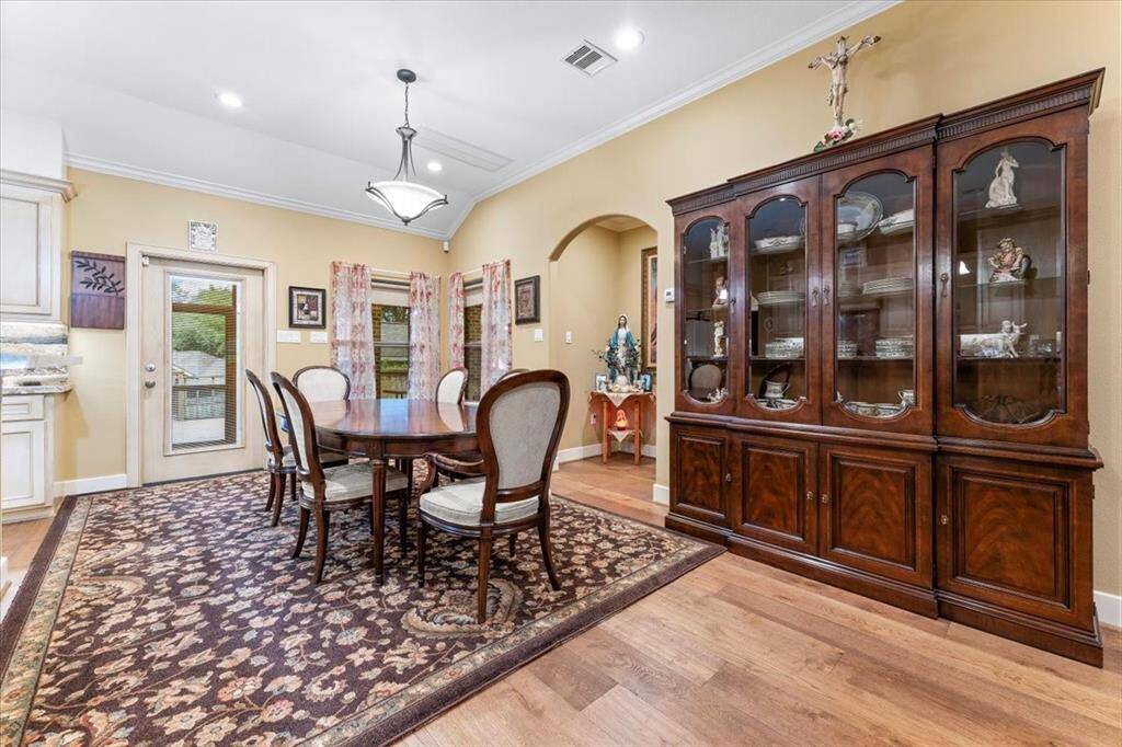 Plenty of room is available for either a formal dining table or a breakfast table, you will note there is crown molding throughout.