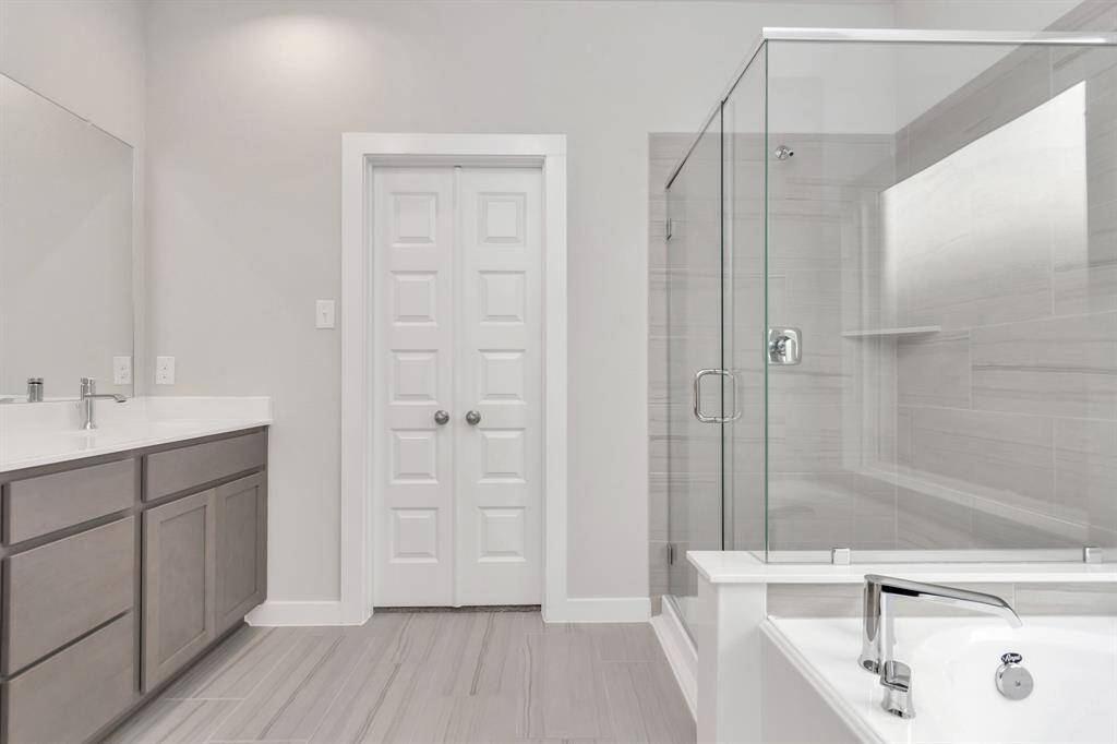 Escape to a spa-like oasis in this primary bathroom. Sample photo of completed home with similar floor plan. As-built interior colors and selections may vary.