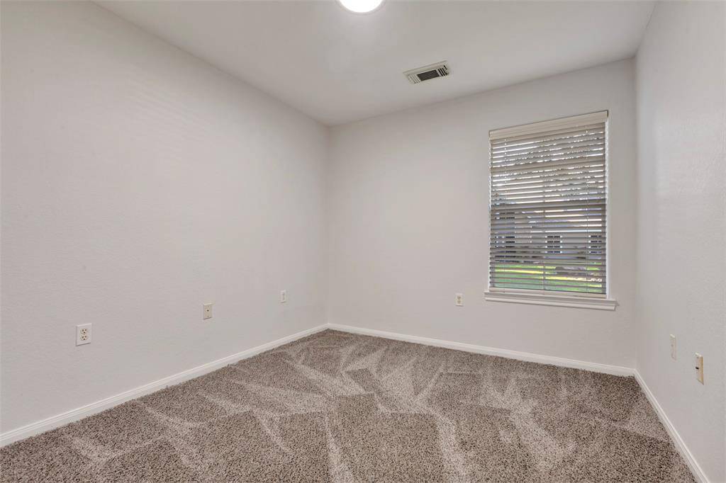 One of the downstairs bedrooms.