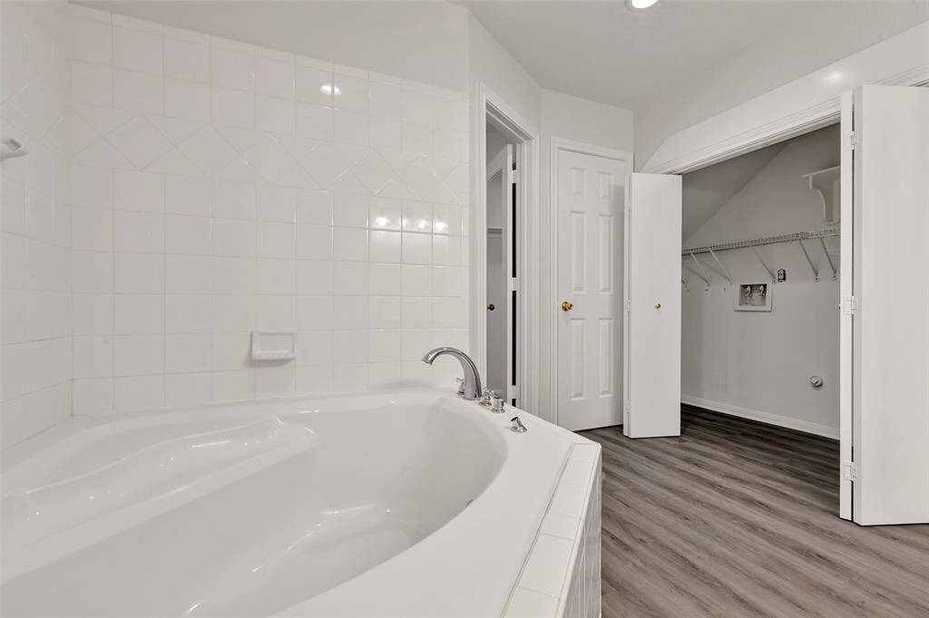The laundry closet is located in the downstairs bathroom.