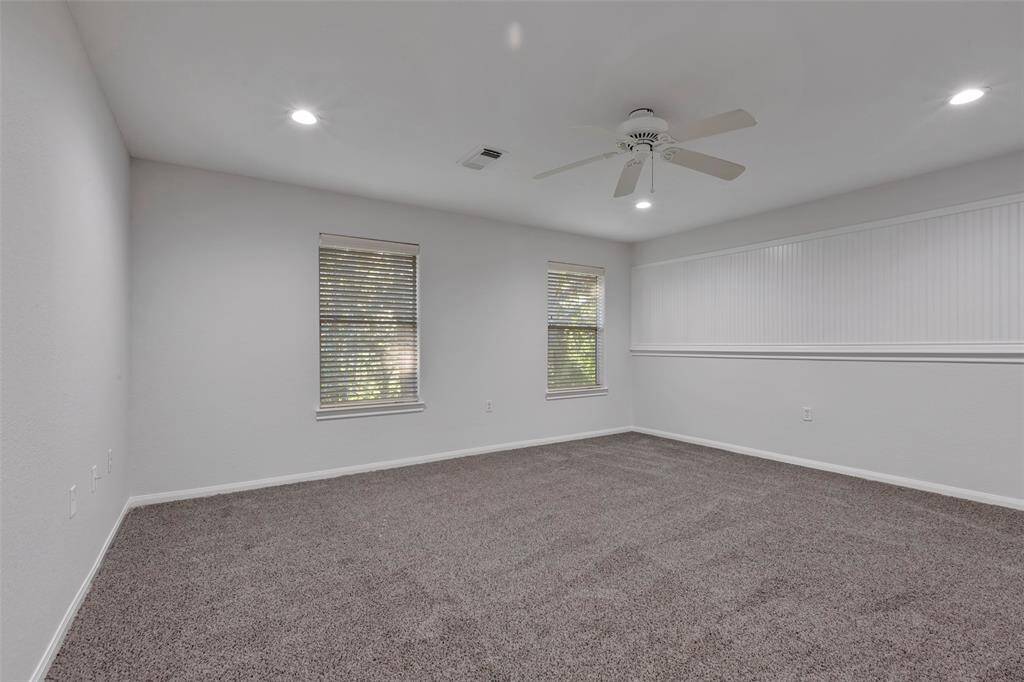 Another view of the upstairs bedroom/game room.