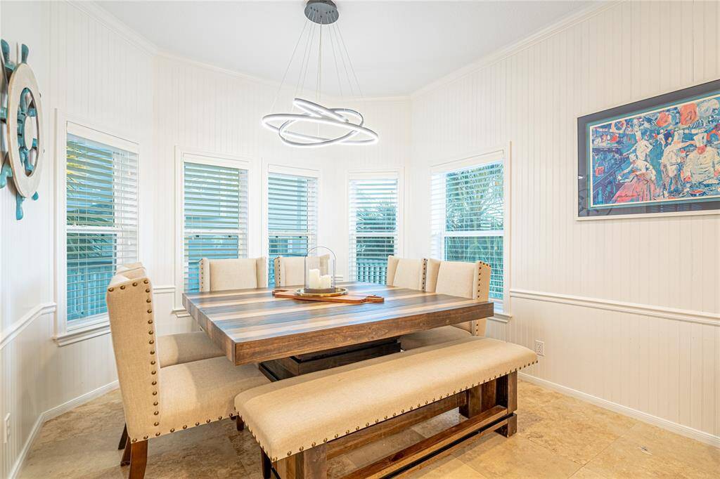 Enjoy Gulf breezes and breathtaking sunsets from this expansive upper-level deck—an ideal spot to unwind or entertain.