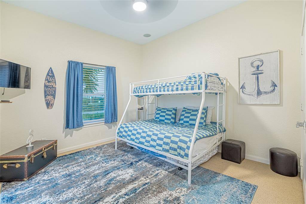 Ideal for families or guests, the secondary bedroom features built-in bunk beds and a walk-in closet —fun and functional.