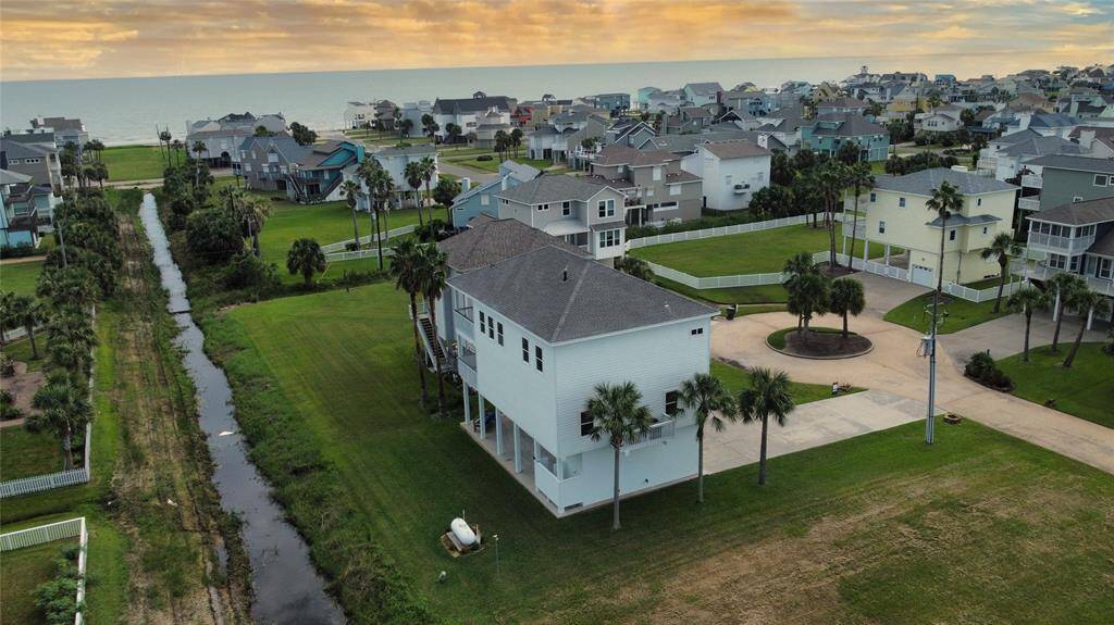 So close to the water you can feel the breeze—this stunning beach home sits just two blocks from the Gulf, offering easy access to the shoreline and sweeping coastal ambiance right from your doorstep.
