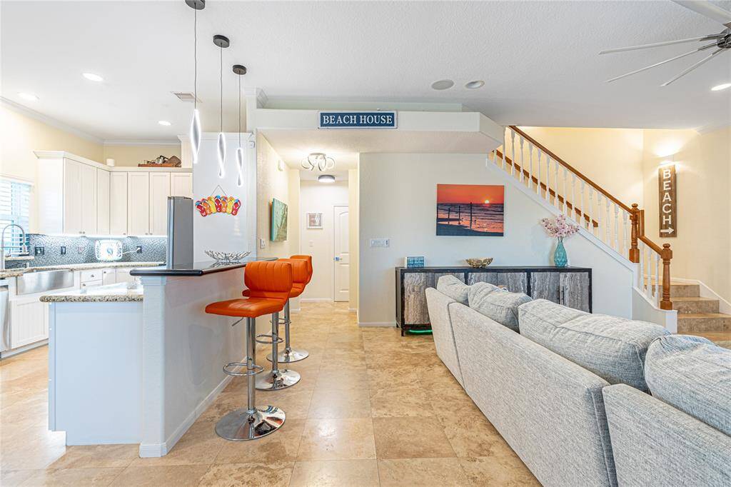 The second primary suite also boasts wood flooring, private deck access, and a serene atmosphere.