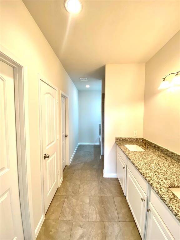 Primary Bath with large walk-in closet and separate tub and shower.