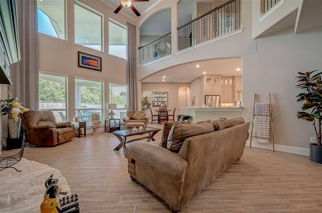 This home has 6 1/4" basboards throughout. These floor to ceiling windows make this family room light and bright.