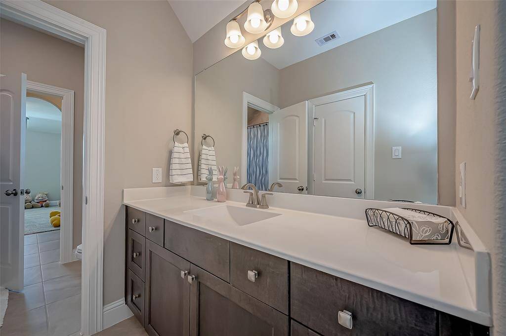 Cultured marble countertops with rectangular undermount sinks. Plenty of storage with pullout drawers and cabinets.
