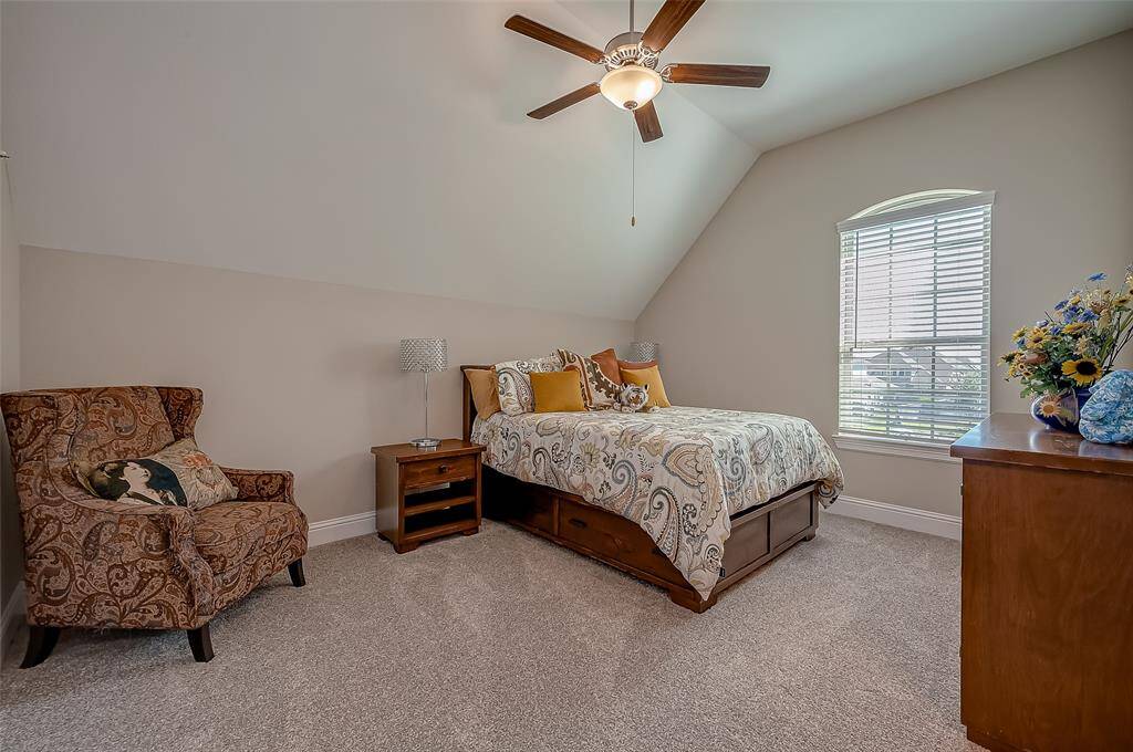 This spacious bedroom is the perfect guest room with en suite bath.