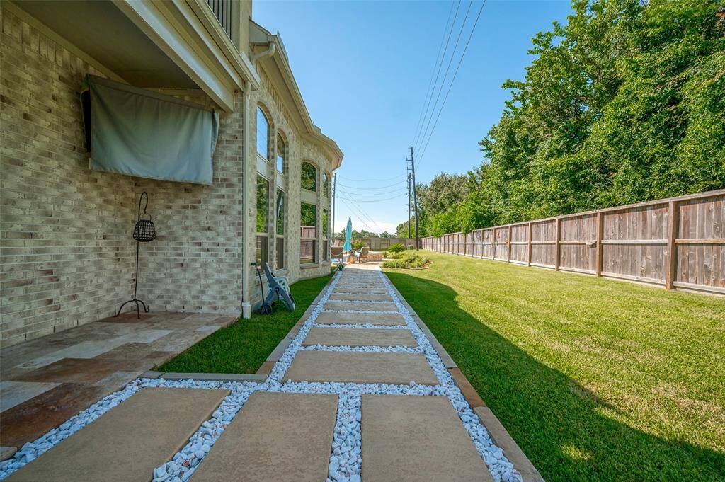 Stunning large pavers leading to your backyard pool.