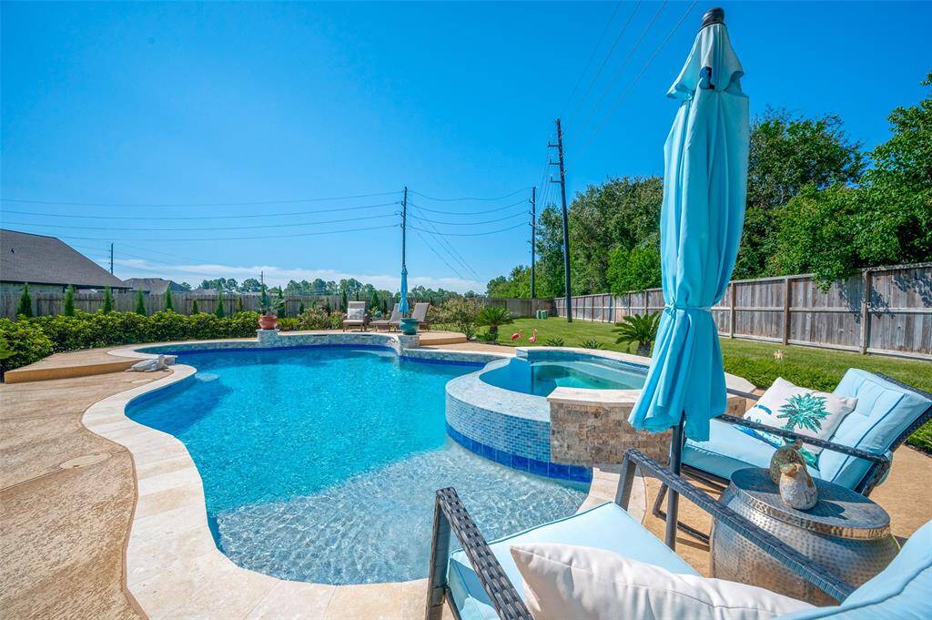 Experience the pinnacle of luxury and relaxation with your very own resplendent oasis, featuring a sparkling pool and an oversized spa that redefines outdoor living.
