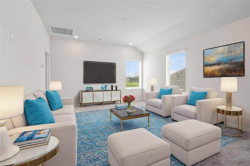 Come upstairs and enjoy a day of leisure in this fabulous game room/media room! This is the perfect hangout spot or adult game room, this space features plush carpet, high vaulted ceiling, recessed lighting, custom paint and large windows with blinds. *virtually staged*