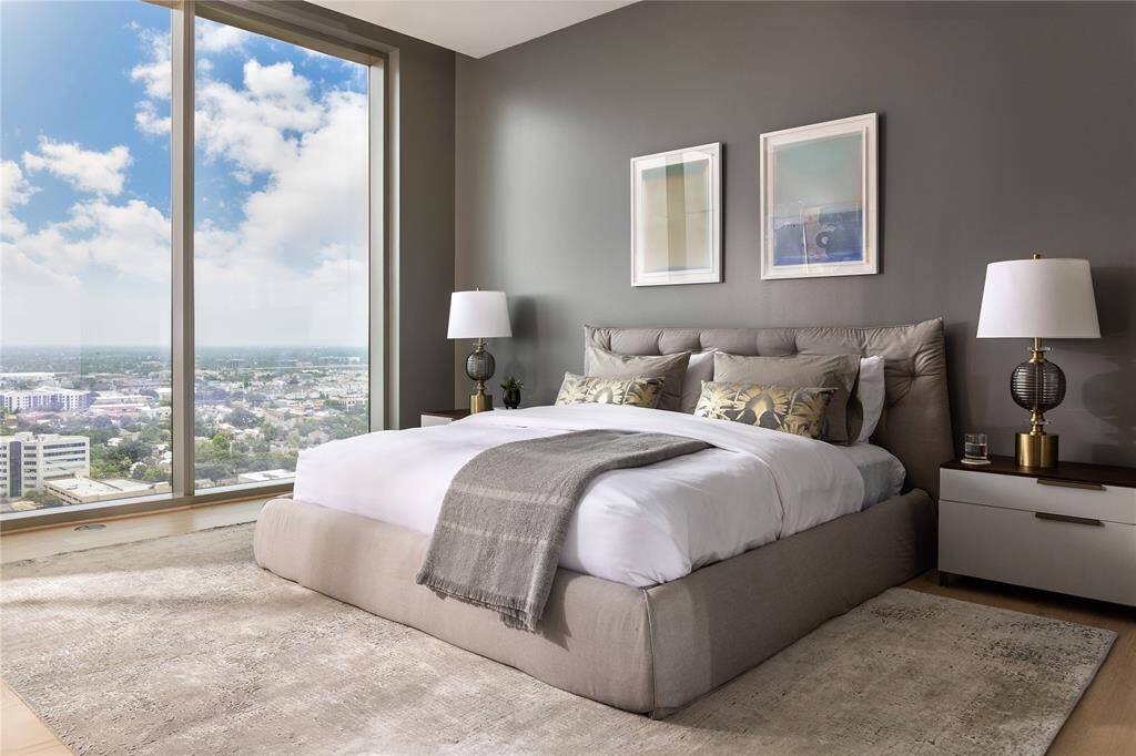 The luxurious primary suite provides a serene sanctuary. *Model photo of unit