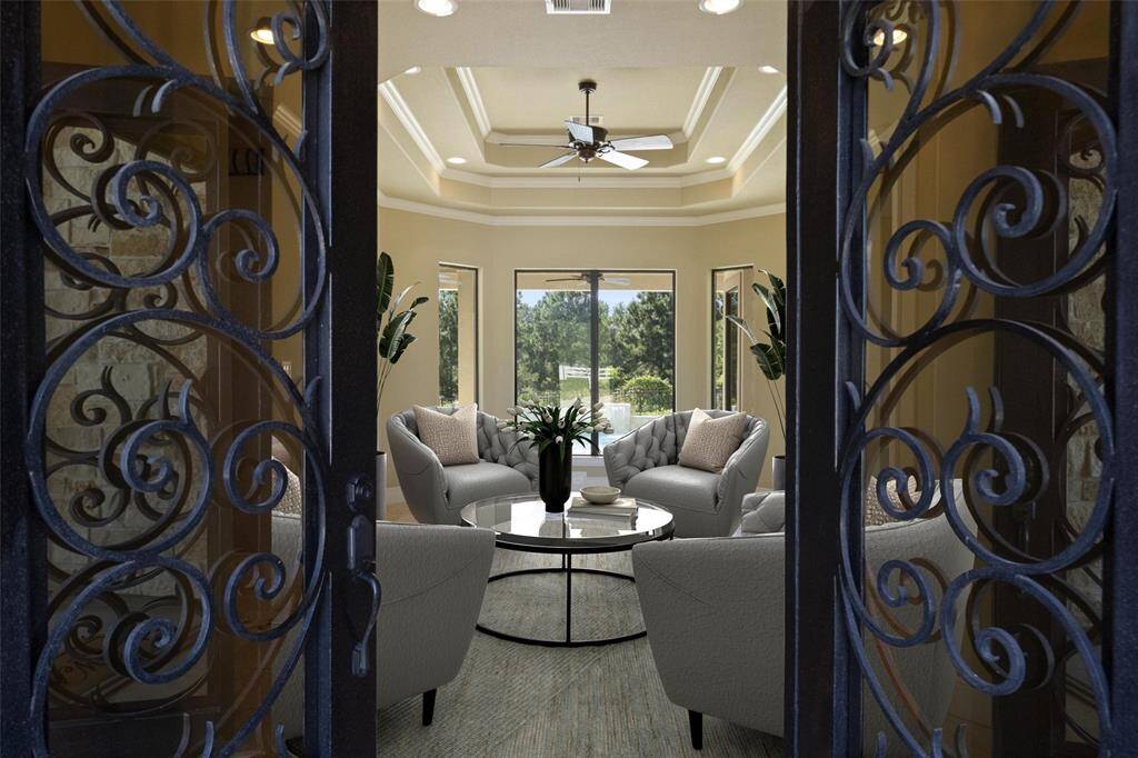 Step through elegant wrought-iron doors into a welcoming formal lounge, ideal for hosting and relaxation.