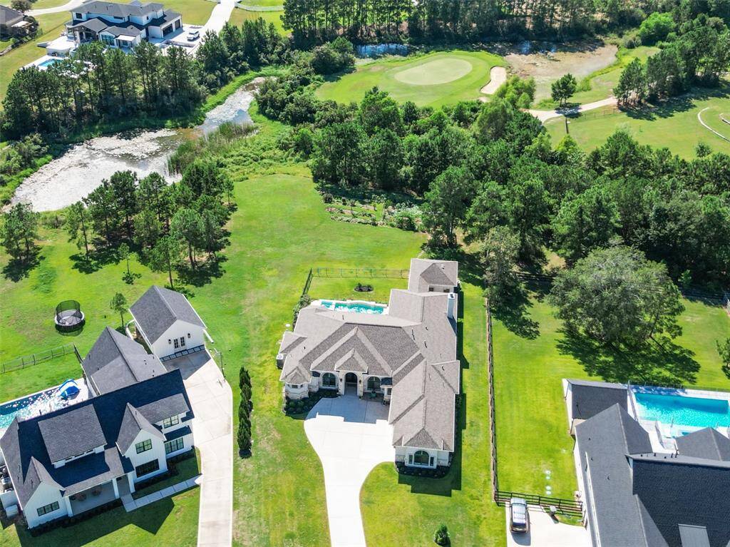 Explore this spacious residence featuring a recently updated roof, perfectly situated on a sizable property with stunning golf course views, offering an ideal mix of luxury living and outdoor enjoyment.