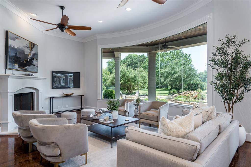The family room has panoramic views of the opulent backyard.