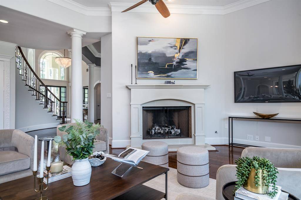 Cozy limestone fireplace anchors the family room.