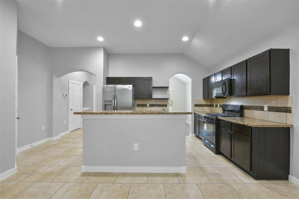 he spacious layout seamlessly connects the living, dining, and kitchen areas, making it an entertainer’s dream.