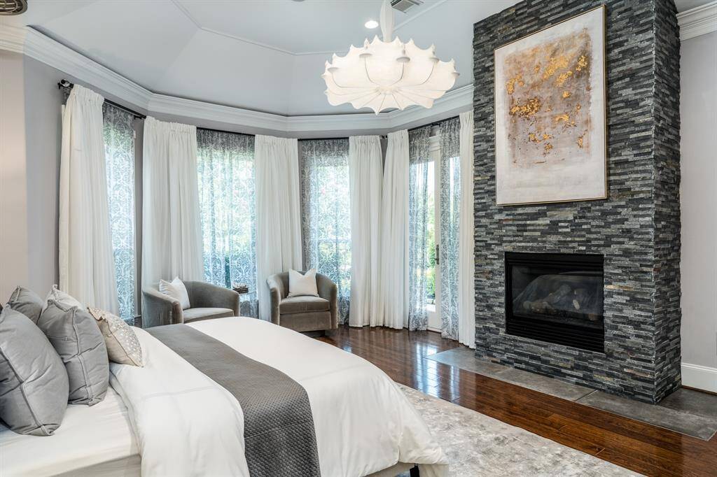 Updated fireplace, beautifully architectured ceiling, and French doors for easy access to the pool and spa.