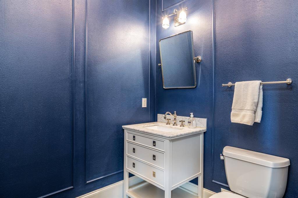 One of the two half baths in the home convenient to the entertaining spaces.