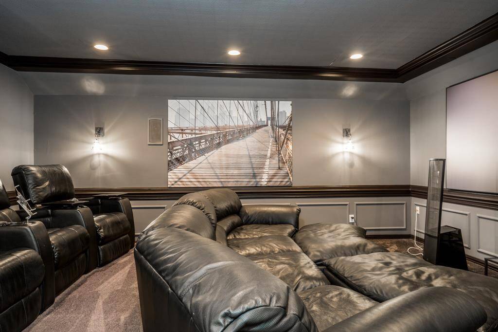 Large theater room where the furniture and media equipment are included.