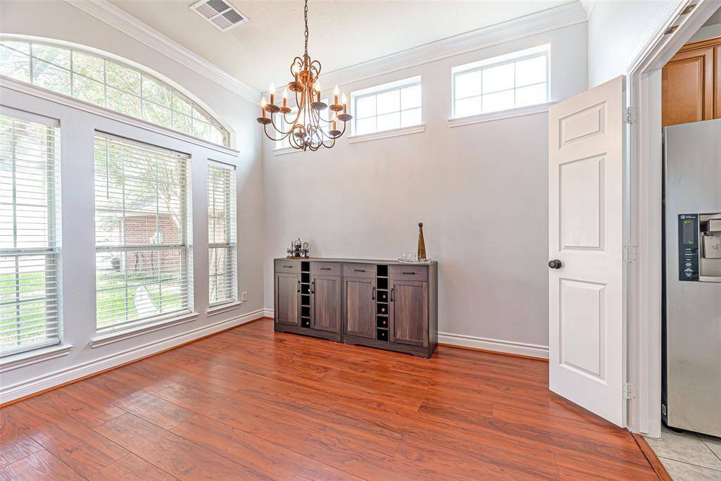 Engineered floors and tons of natural light fill the dining space.