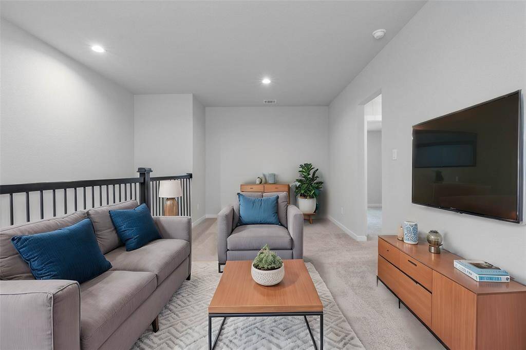 Perfect for entertaining is this amazing loft! Right upstairs this space would be a fabulous teen hangout, media room, or adult game room! Featuring plush carpet, high ceilings, recessed lighting, and custom paint!