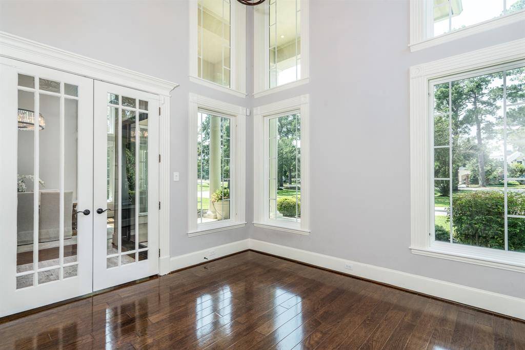 French doors to the study off the entry with a two story ceiling. Windows were upgraded in 2015.