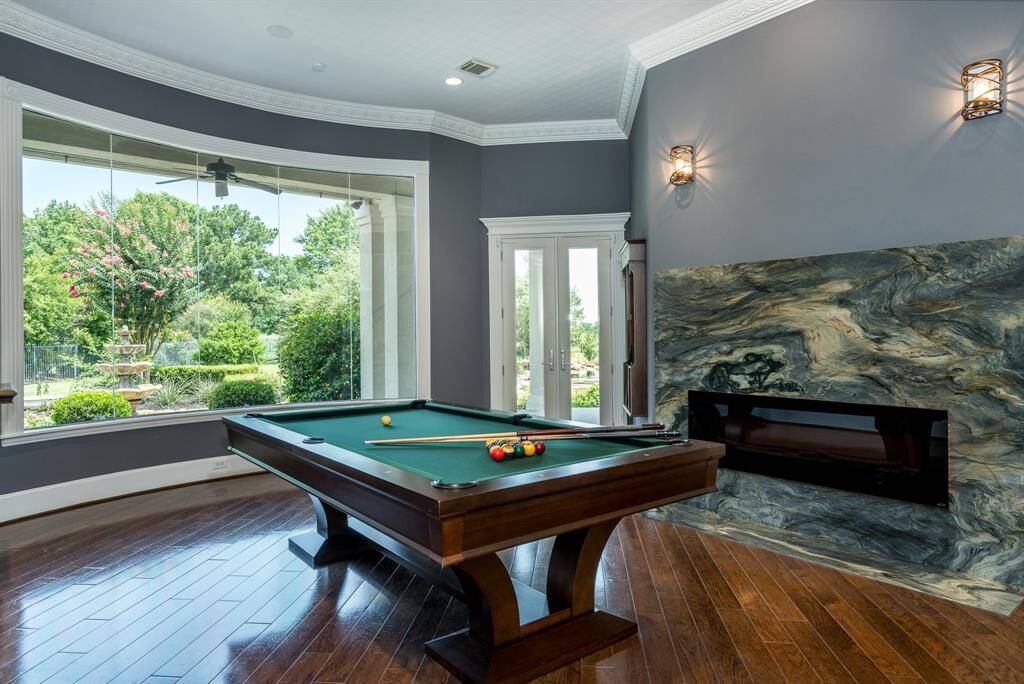 Dramatic electric fireplace with marble surrond in the living space - a place to enjoy wine with storage already built-in nearby.