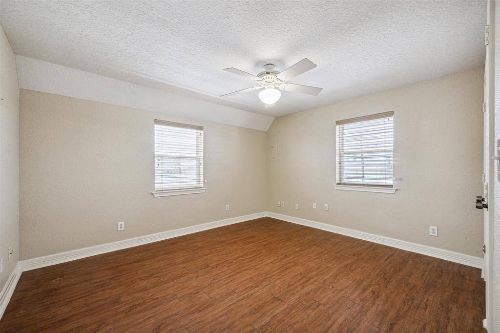 A view of the secondary bedroom located off the kitchen area