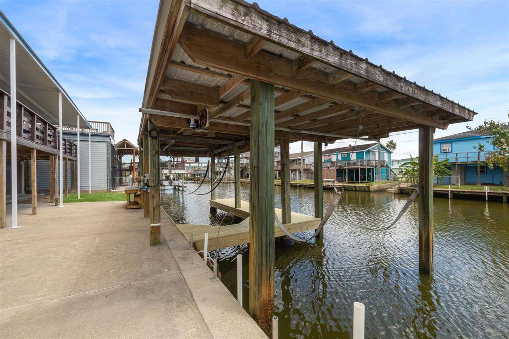 A boat house with two motorized boat slings is right off the patio area