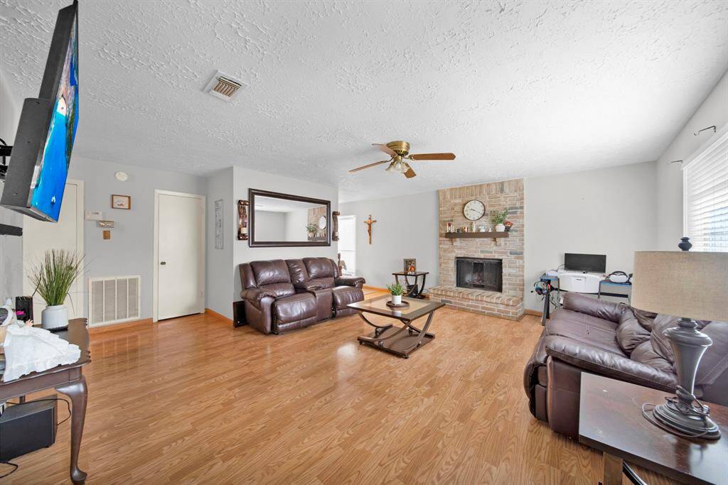 Entry into family room includes wood burning fireplace