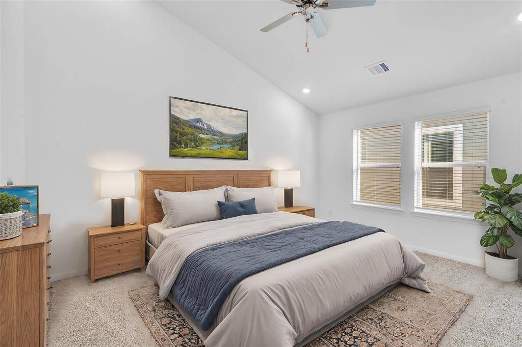 What a wonderful place to come home to, this stunning primary suite greets you with plush carpet, a neutral custom paint, high ceiling, ceiling fan with lighting, large windows with blinds allowing in natural light brightening up this spacious primary bedroom. *virtually staged*