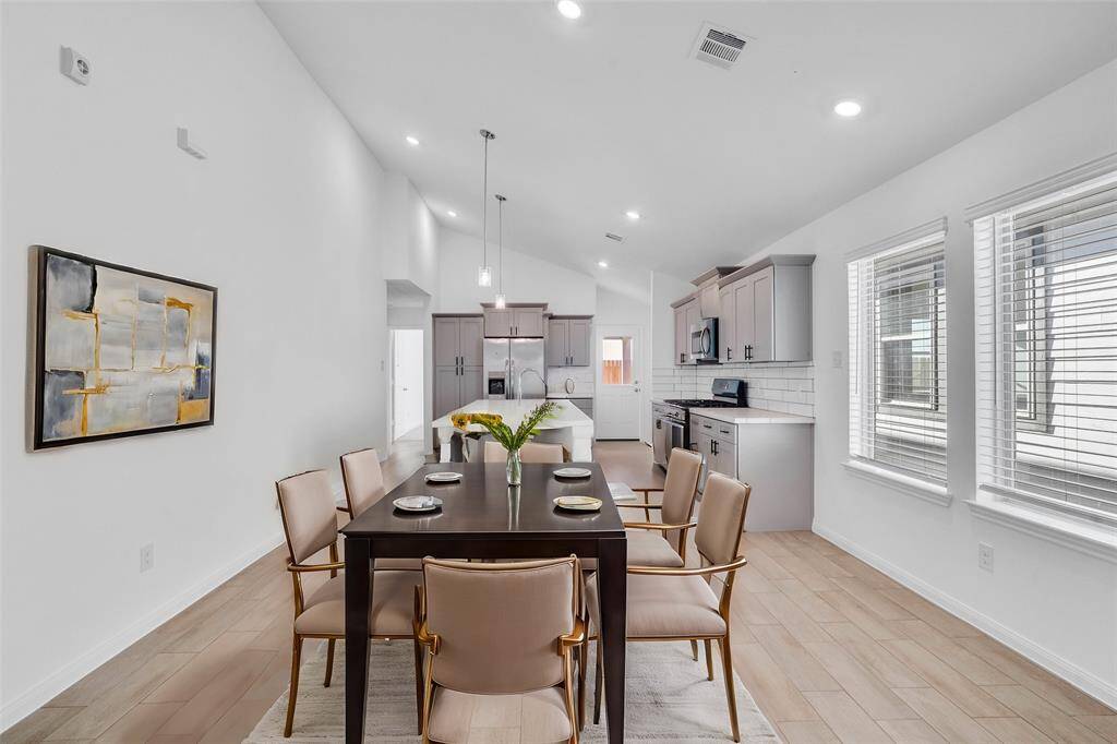 Start your day off right with a cup of coffee sitting with your family in the lovely dining/breakfast area! Featuring large windows with blinds, custom neutral paint, tile flooring, and high ceilings. *virtually staged*