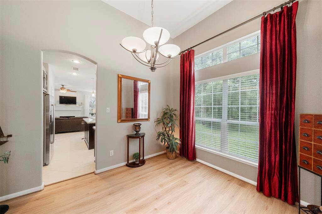 Primary bedroom features cozy sitting area.