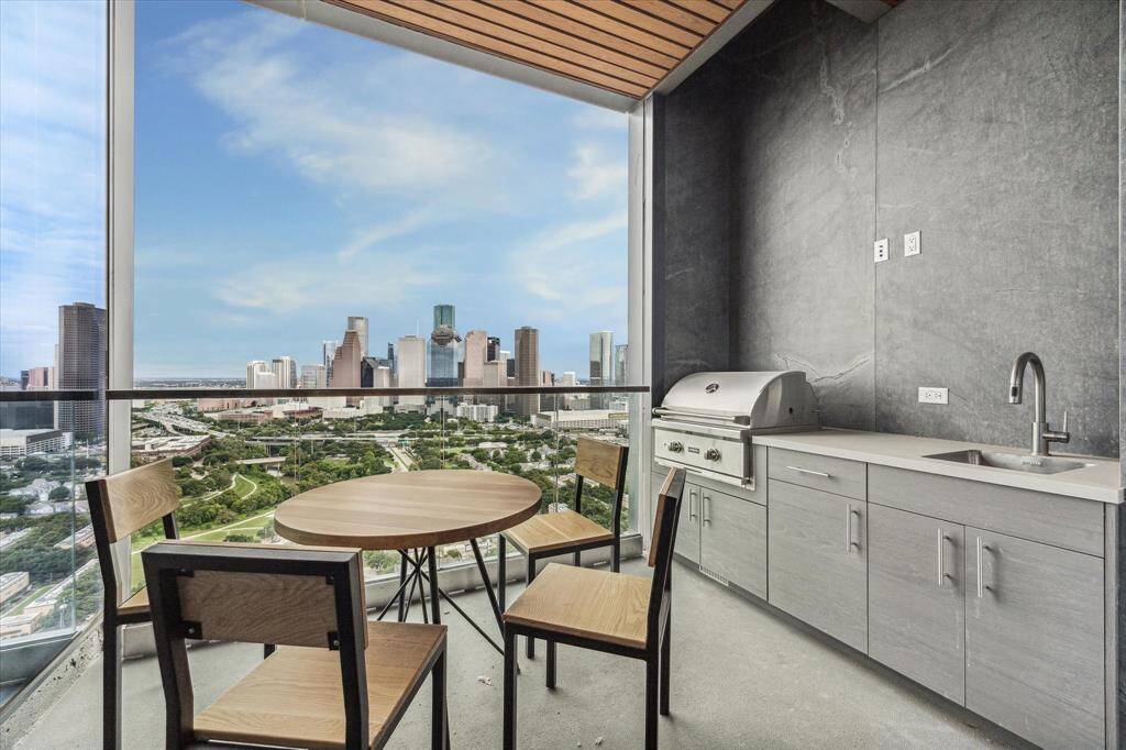 Dedicated private balcony and summer kitchen.