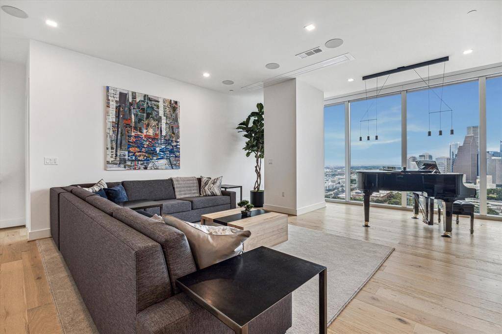 Panoramic city views with floor to ceiling windows.