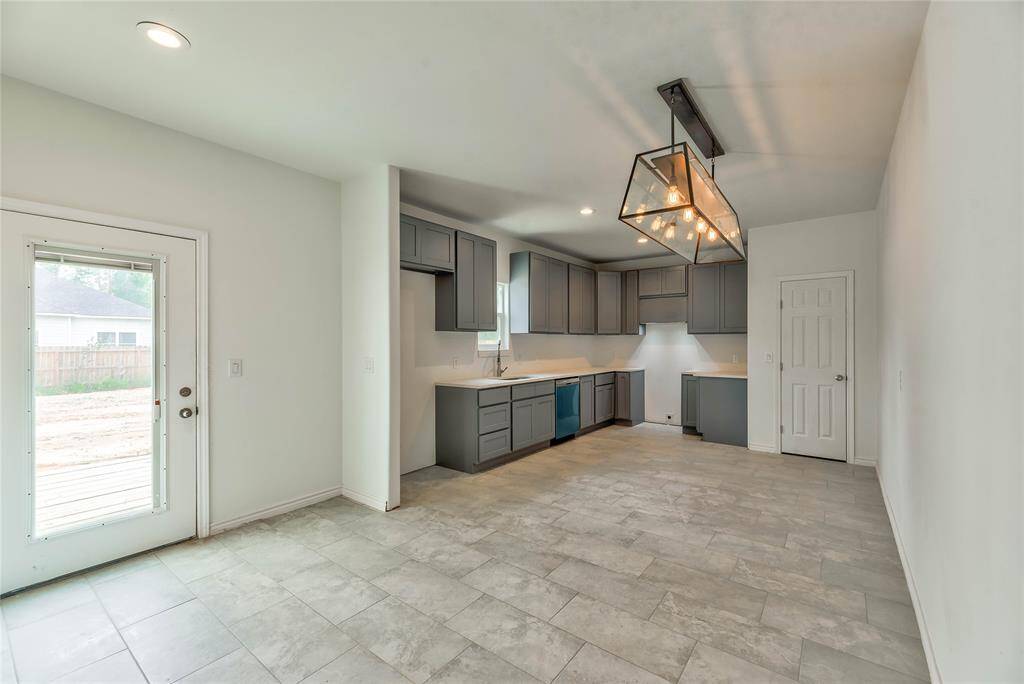 KITCHEN WITH QUARTZ COUNTERTOP,NEW RANGE AND DISHWASHER, 42 INCH CABINETS, LARGE FOOD PANTRY