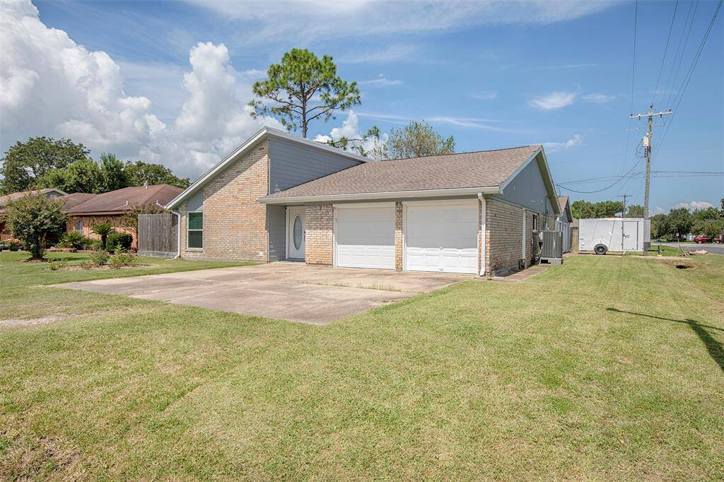 This home has an attached two-car garage and a separate garage behind the home.