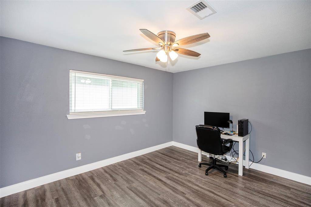 This secondary bedroom has a wonderful ceiling fan.