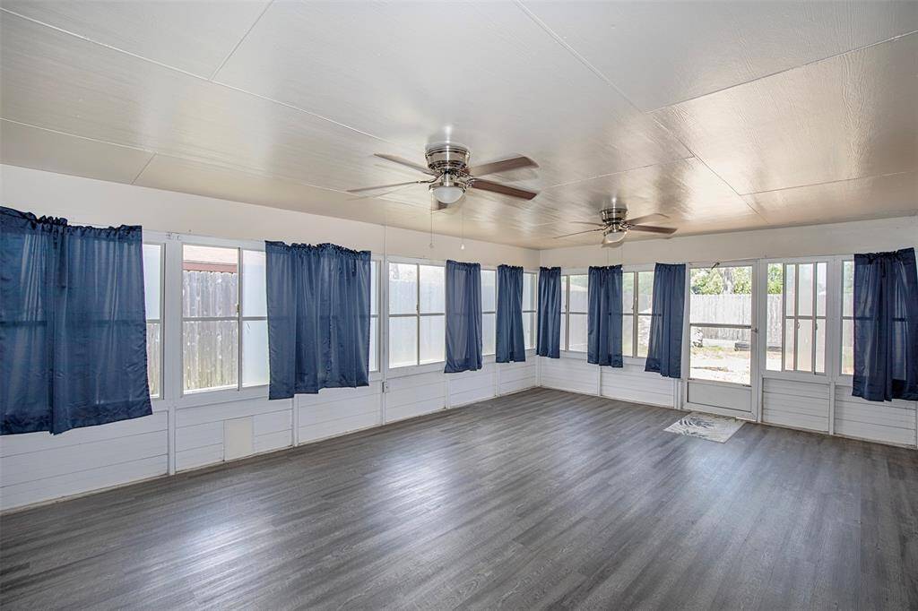 Huge enclosed patio that could be used as a sunroom or maybe even a home gym.