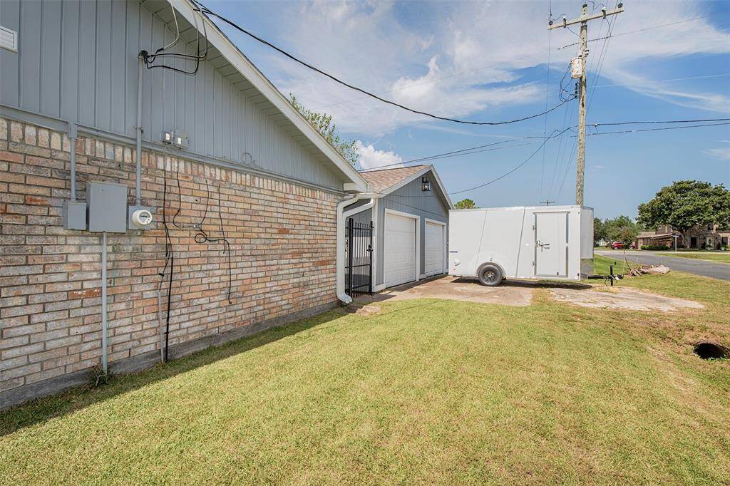The two-car garage that sits behind the home has an access point inside the gated yard.