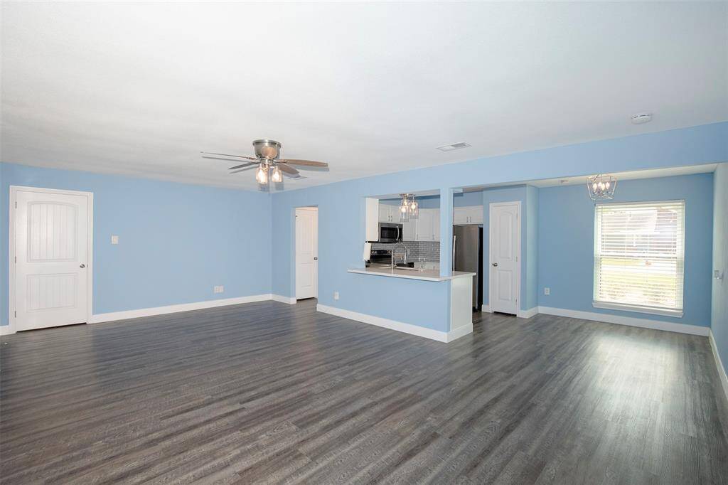 The family room seamlessly transitions to the dining area and kitchen.