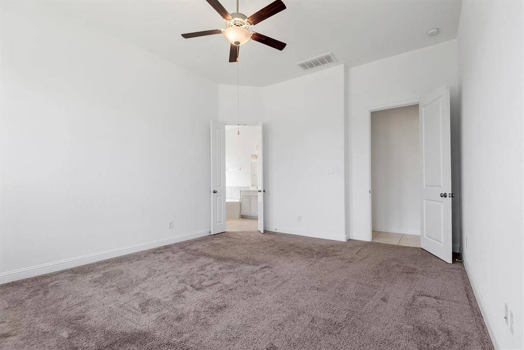 Primary bedroom with access to your ensuite bathroom.